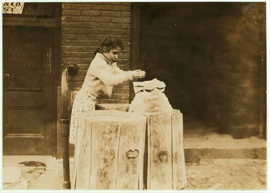 Picking over ash barrels. Boston, Mass., Oct. 1909. L.W.  Location:…, Massachusetts