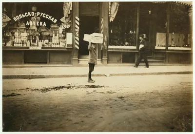 Carrying wood home.  Location: Boston, Massachusetts, 1909