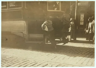 School boys, "flipping cars," noon.  Location: Boston, Massachusetts, 1909