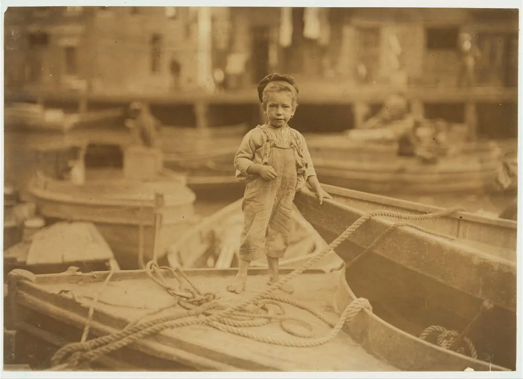 Truant hanging around boats in the harbor during school hours. …, Massachusetts, 1909