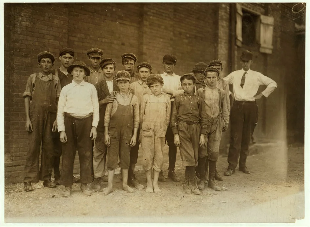 Group of doffers in Pell City Cotton Mill posed by the Overseer.…, Alabama, 1910