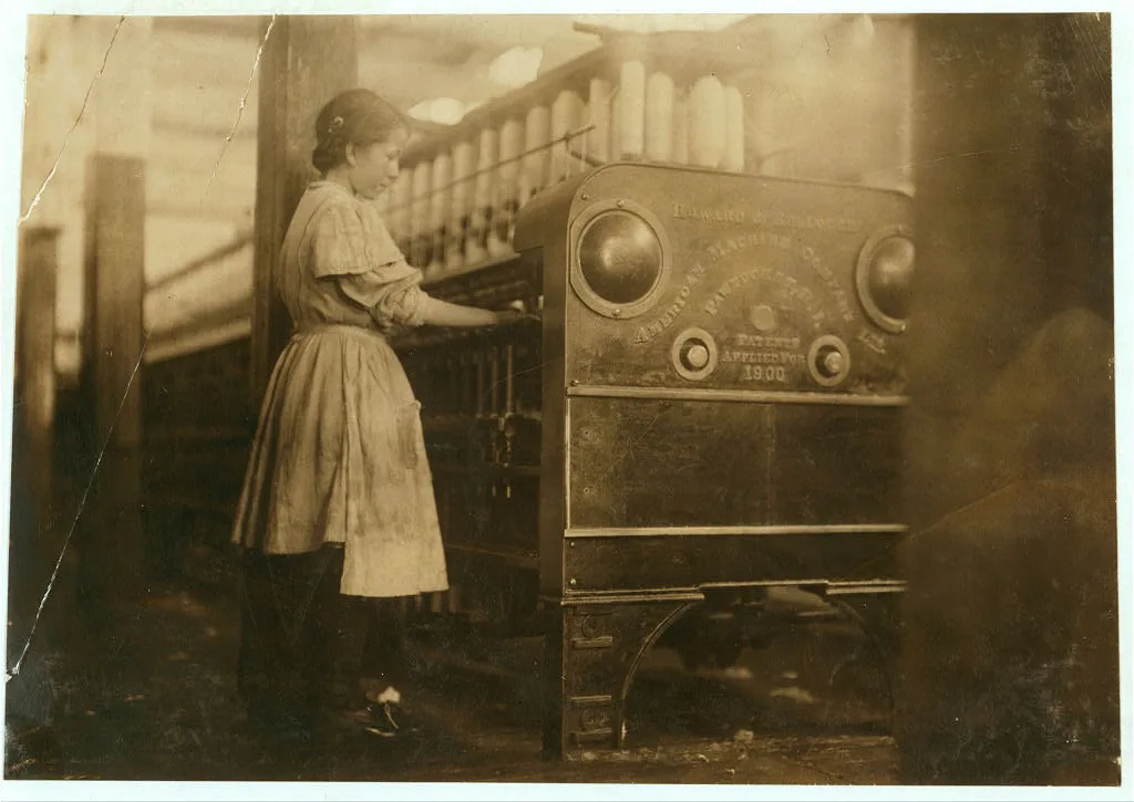 Young girl working in Anniston Yarn Mills.  Location: Anniston,…, Alabama, 1910