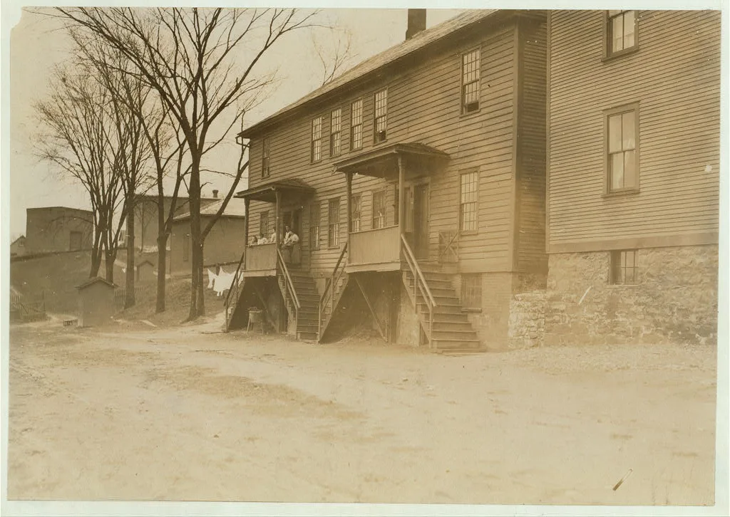 A four-family house crowded close to the Chace Cotton Mill,…, Vermont, 1909