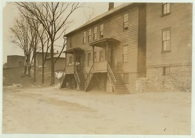 A four-family house crowded close to the Chace Cotton Mill,…, Vermont, 1909