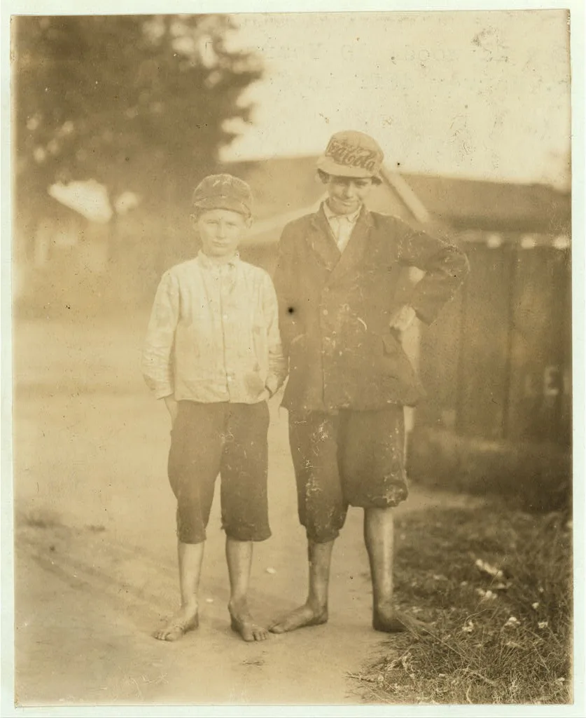 Guy Haywood, 10 years old, helps his brother. Harvey doff[s] in…, Georgia, 1913