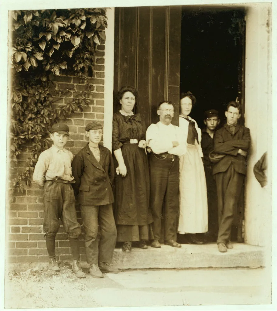 Group working in Holden-Leonard Co., Bennington, Vt. Smallest boy is…, Vermont, 1910