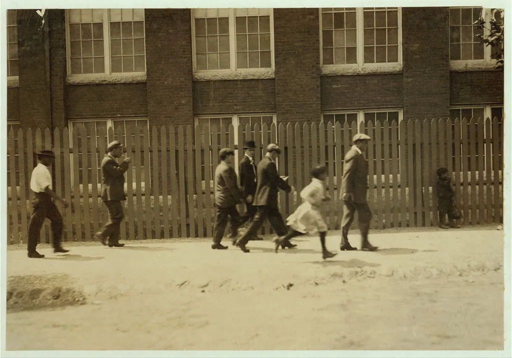 Group going out at noon from the Kilburn Mills. Little girl running…, Massachusetts, 1911