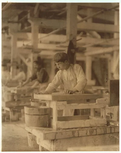 Young boy polishing marble in Vermont Marble Co., Centre Rutland, Vt.…, 1910