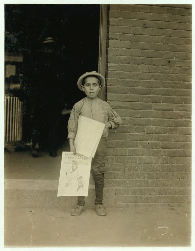 Small newsie at depot, Burlington, Vt.  Location: Burlington, Vermont, 1910