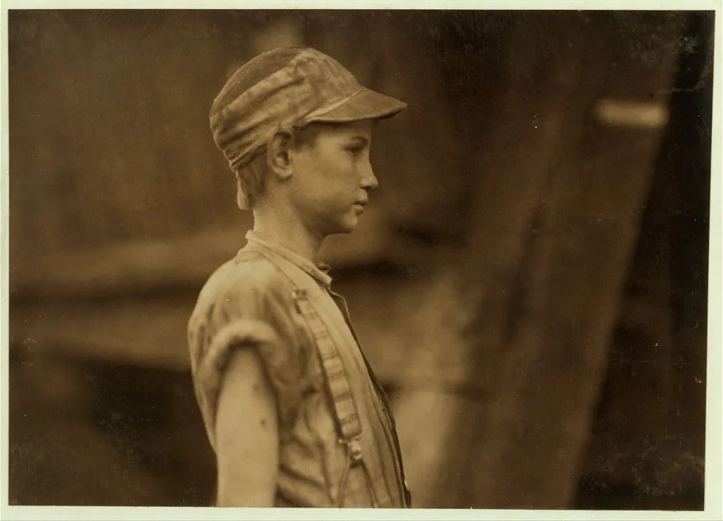 One of the young doffers in Avondale Mills.  Location: Birmingham,…, Alabama, 1910