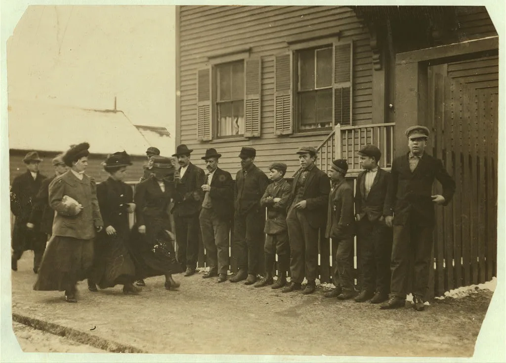 [Young girls running gauntlet of men making remarks (sometimes…, Massachusetts, 1912