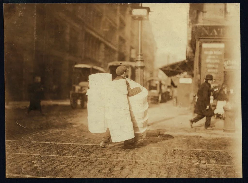 Boy carrying hats. Bleecker Street, N.Y. Location: New York, New York…, New York (State), 1912