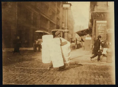 Boy carrying hats. Bleecker Street, N.Y. Location: New York, New York…, New York (State), 1912