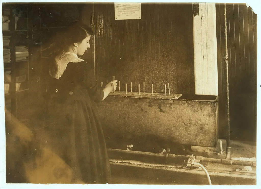 Celina Melchionno, 14 years old, waxing (dipping) flowers at the…, Massachusetts, 1917