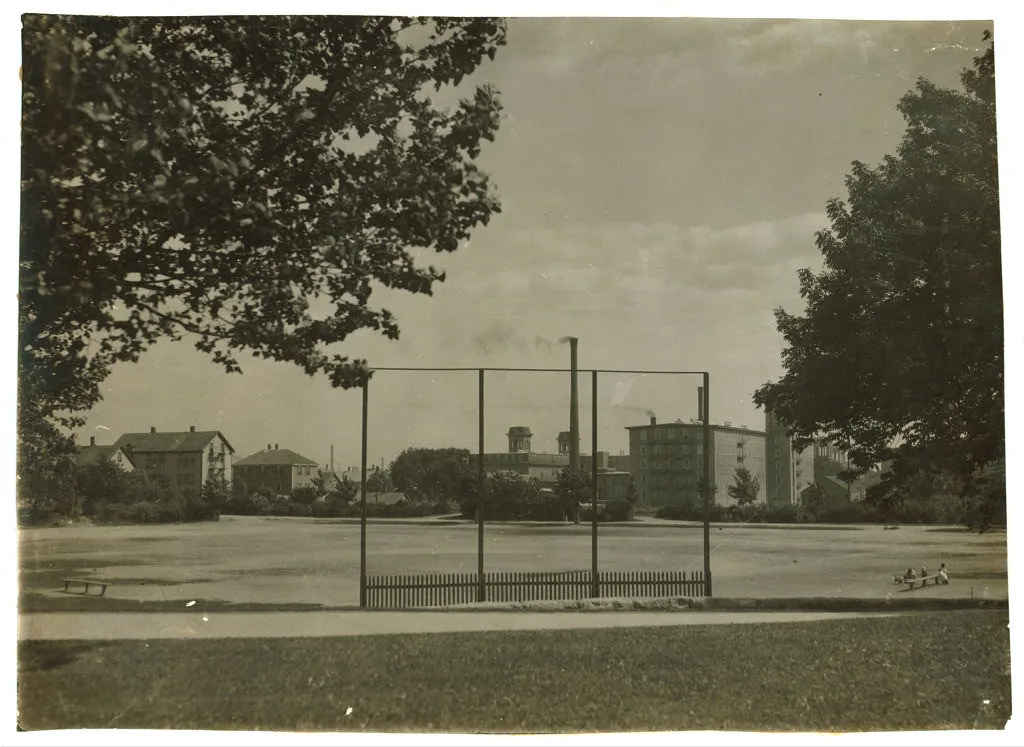 Ruggles Park Playground. Empty 3 P.M. Granite Mills in background. …, Massachusetts, 1916