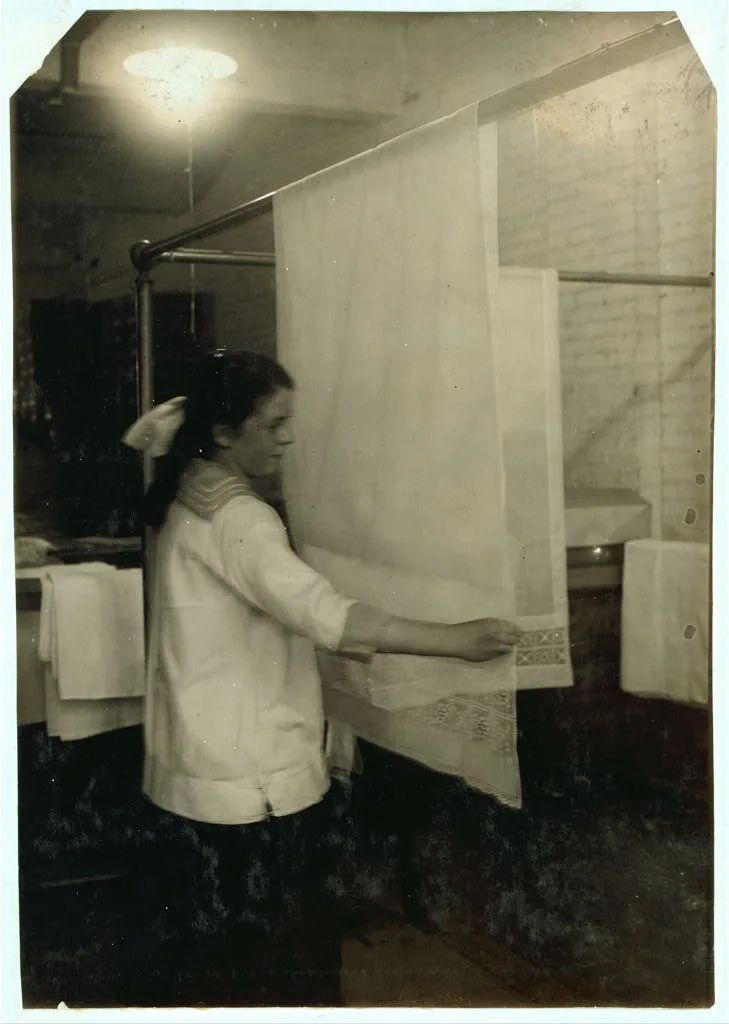 Katherine Flanagan, 15 years old. Examining curtains at Boutwell,…, Massachusetts, 1917