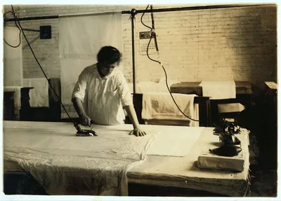 Sadie McGurin, 15 years old. Pressing curtains at Boutwell,…, Massachusetts, 1917