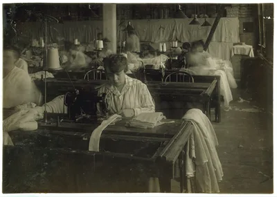 Bessie Blitch, 15 years old. Sewing curtains on machine at Boutwell,…, Massachusetts, 1917