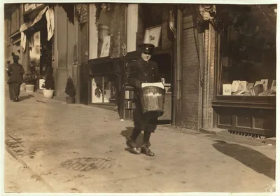 A small messenger with a heavy load. Special delivery messenger #10.…, Massachusetts, 1917