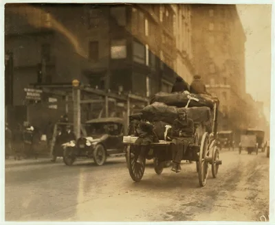 [P.M. Delivery boys on Tremont Street, "getting a hitch."]  Location:…, Massachusetts, 1917
