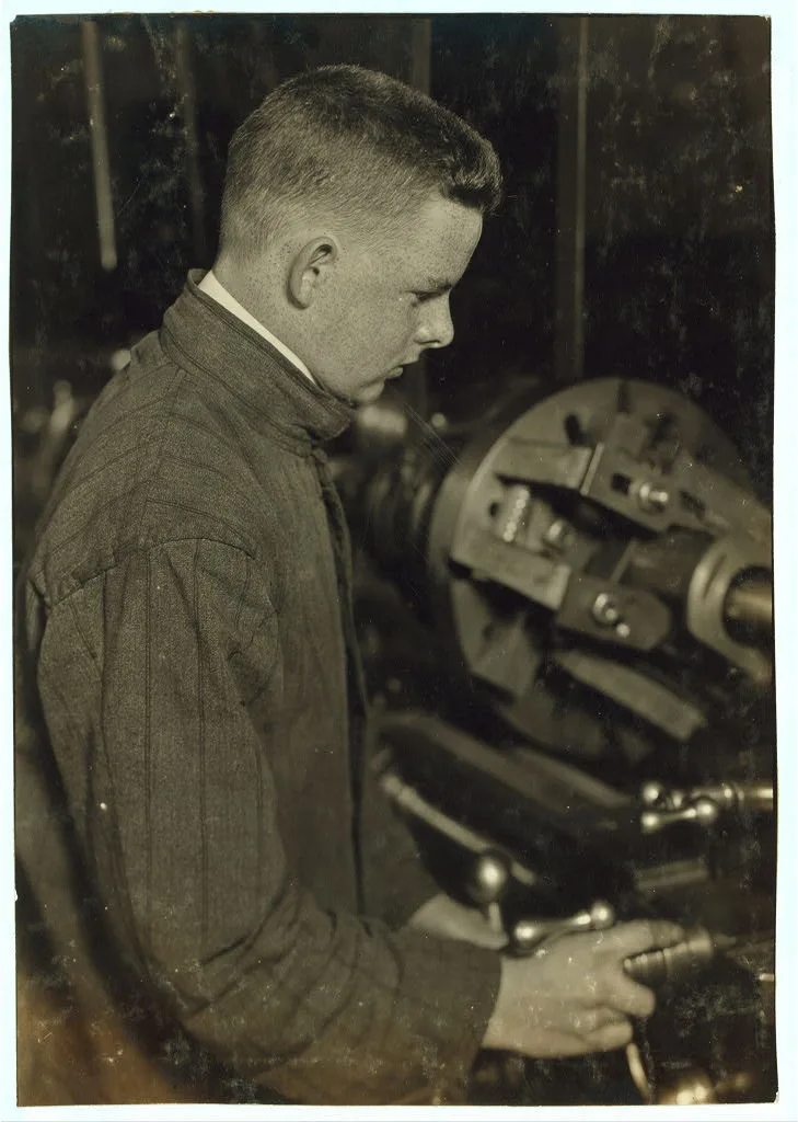 Vocational class. Boring at a lathe. 15 years old.  Location: Fall…, Massachusetts, 1916